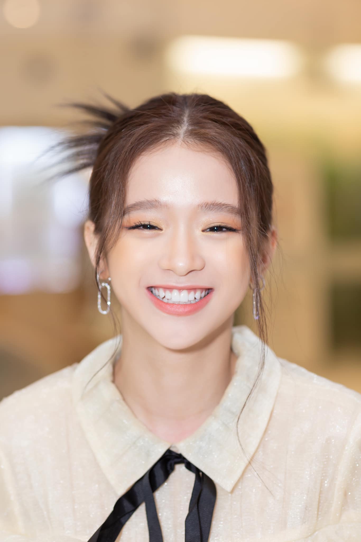 She even shows off her bright white teeth with the caption 'Smiling to show some teeth'