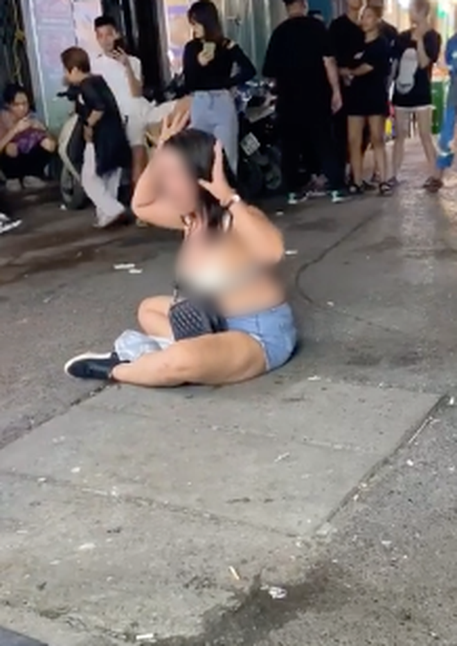 She then took off her shirt in front of many witnesses. Screenshot from video