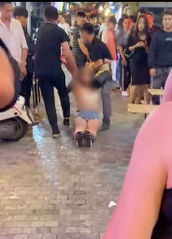 She was then carried away. Screenshot from video