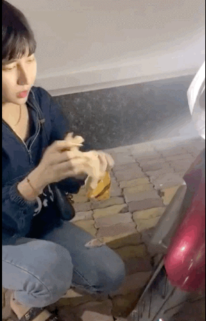 The TikToker wipes down his scooter with tissue after spraying perfume.