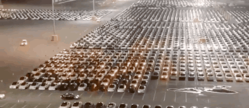 Tesla cars updating software in parking lot