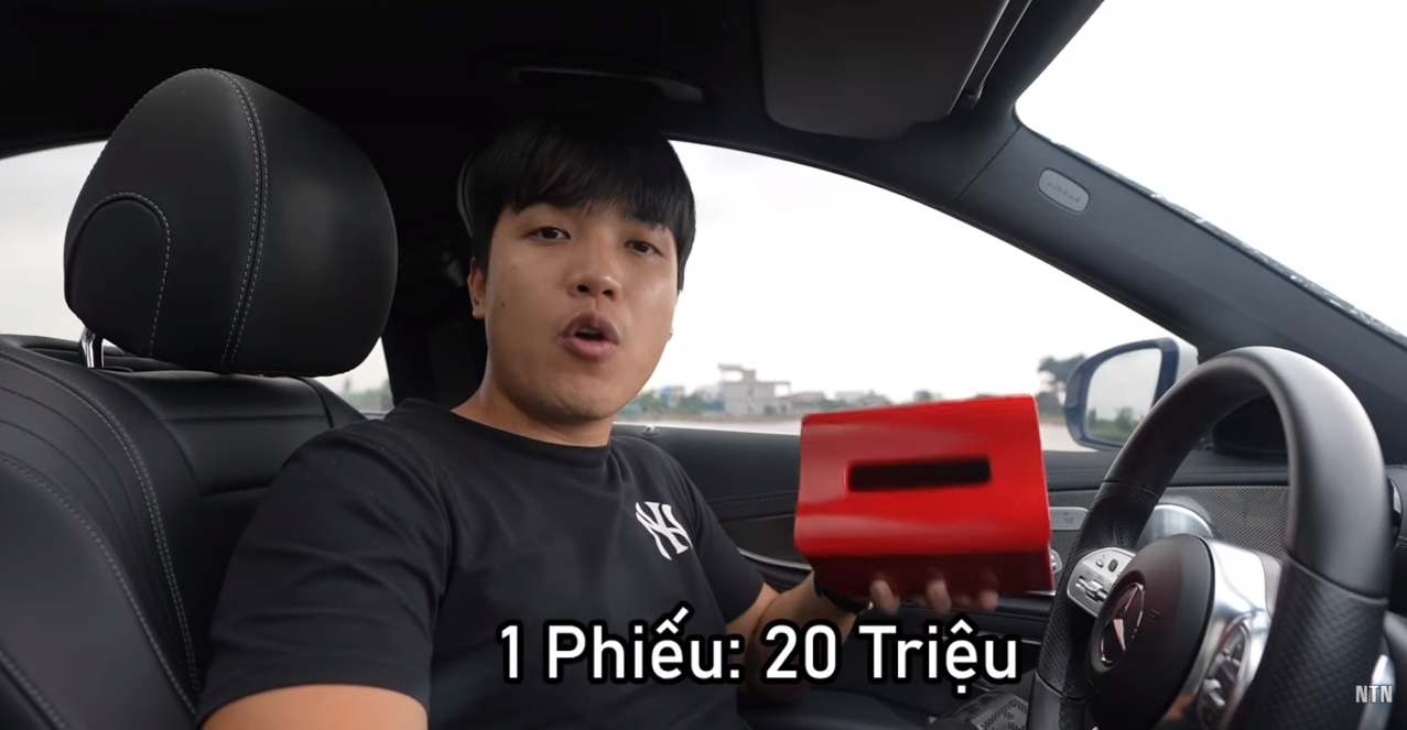 NTN Surprises Strangers with Over $6,500 in Cash Giveaways 2 NTN shows off his mysterious box of lucky draw tickets