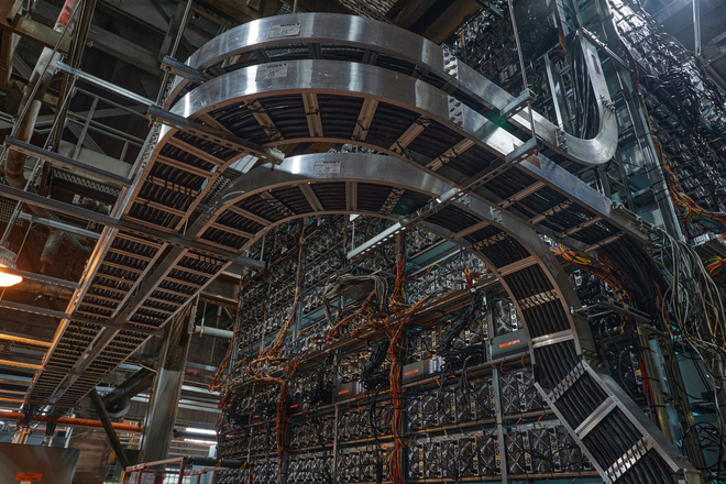 A Bitcoin mining farm with thousands of mining rigs lined up closely