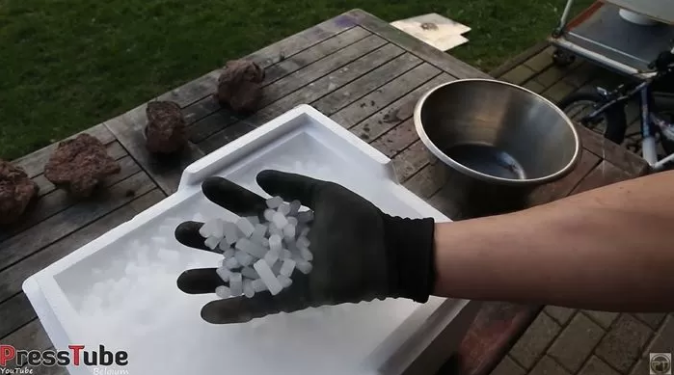 Opening the dry ice box releases thick white vapor, requiring special gloves