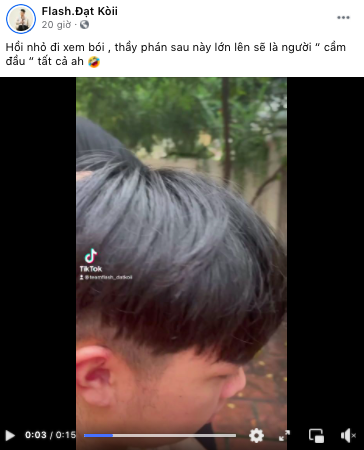 Coach Đạt Kòii smiling after haircut