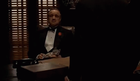 Marlon Brando with a cat in The Godfather