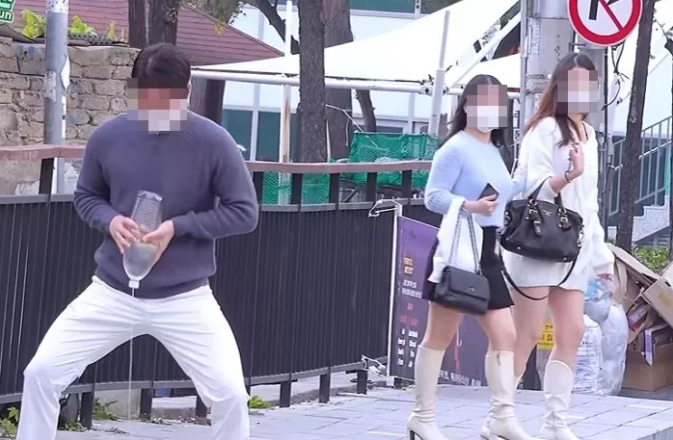 Clearly visible horrified reactions from women passing by