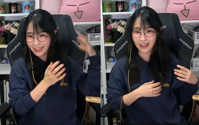 The streamer smiles after the incident, even showing off her slightly singed hair