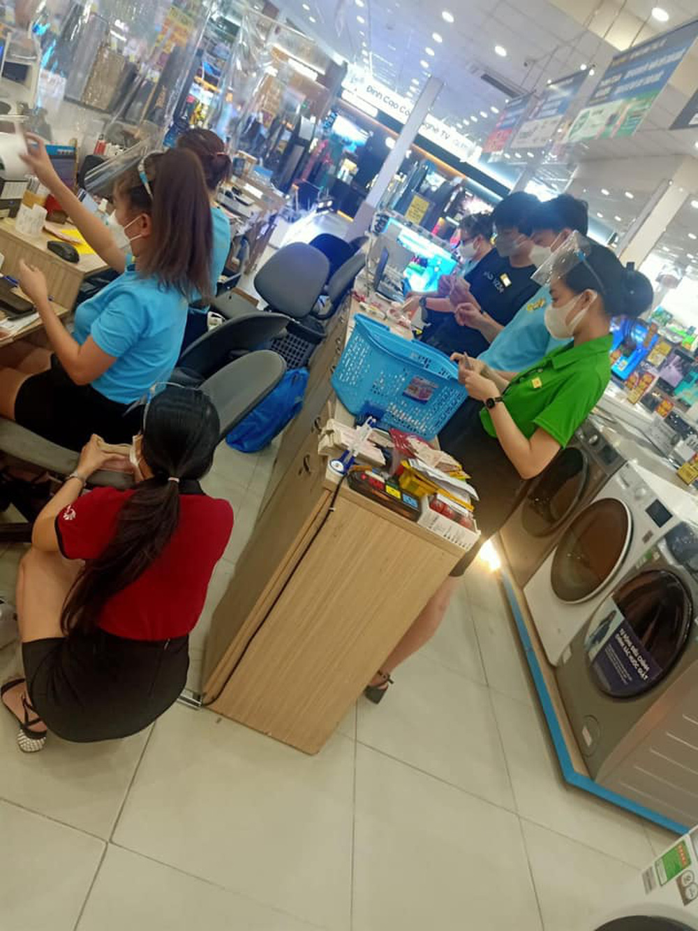 Store staff carefully counting the bills, taking quite some time