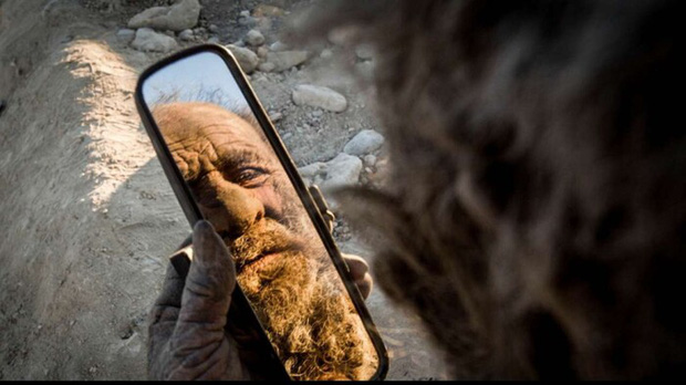 Meet Amou Haji, The Man Who Hasn't Bathed in 67 Years 6 The pipe he uses to smoke dried animal dung
