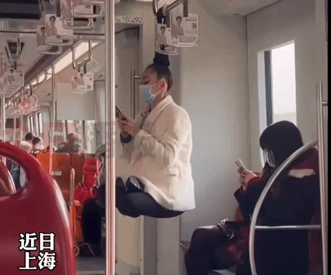 Girl Floats Midair on Shanghai Subway, Stuns Everyone with Her Trick 3 Bold pose causing a social media frenzy