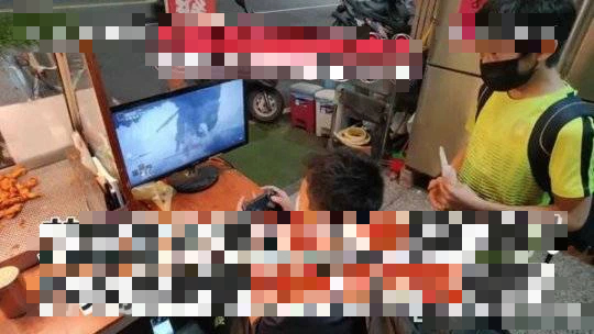 Two elementary students trying to beat Elden Ring boss at the fried chicken shop