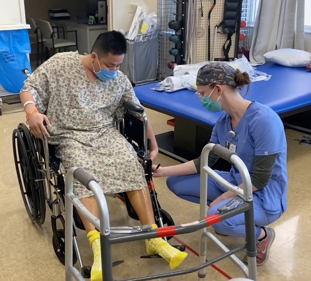 Khoa Pug uses a wheelchair to adapt to the long recovery