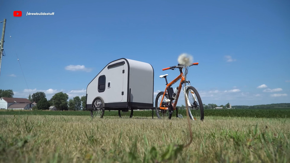 Simple teardrop-shaped mobile home structure, with the key upgrade being the switch from human power to electric motor - Photo: Drew Builds Stuff/YouTube