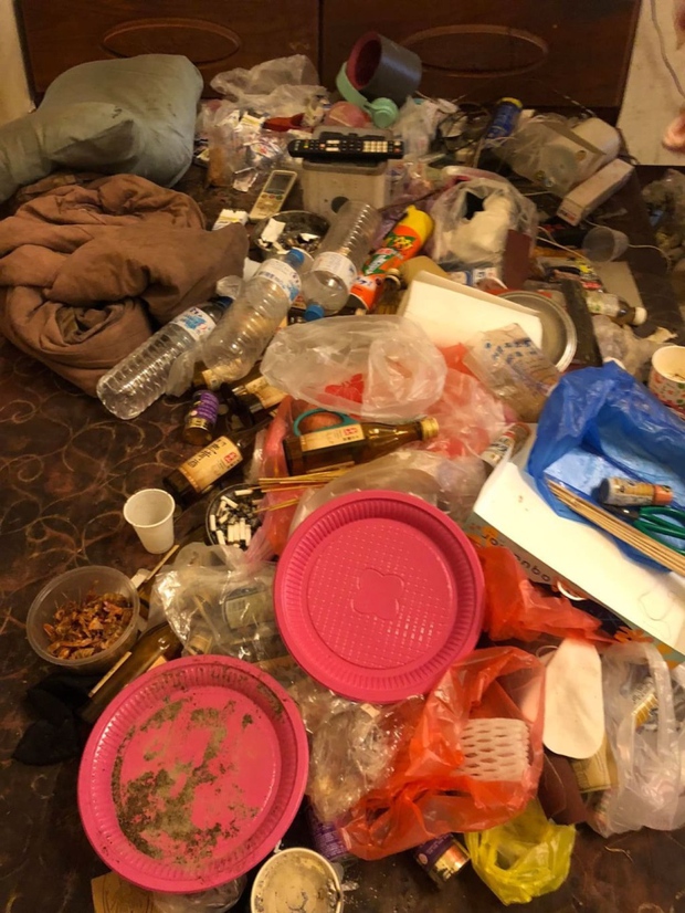 The bed is piled with trash but someone still sleeps there every day.
