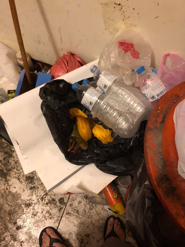 Mango seeds and an empty water bottle tossed in a corner of the room.