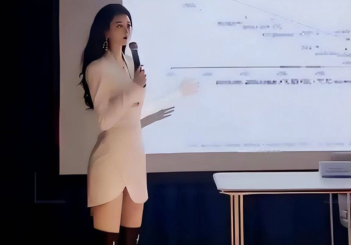 Lecturer in white dress and black boots
