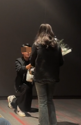 Couple's movie theater proposal moment