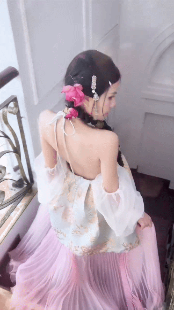 Mai Dora as a fairy goddess showing off her bare back