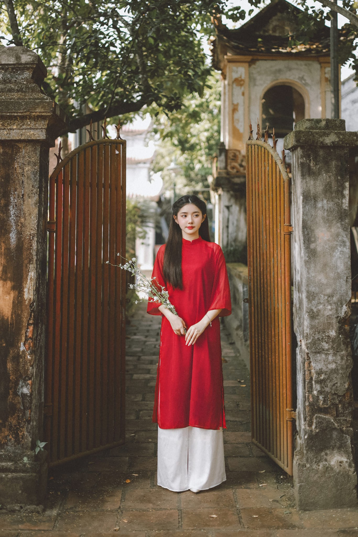 Quỳnh Trương wearing traditional red dress