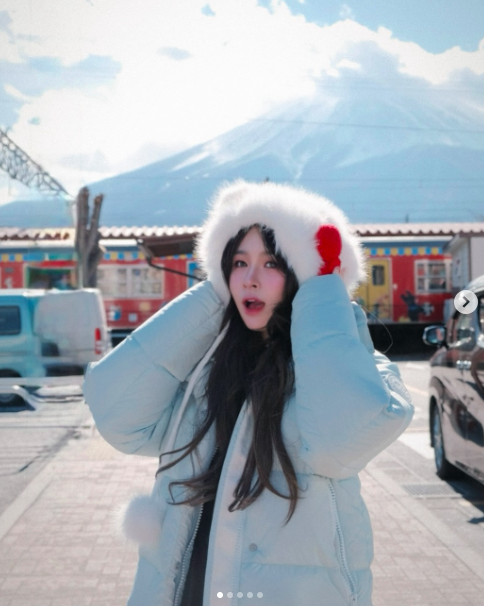 Rich Kid Chao Stuns in Tiny Bikini with Fiery Body 1 Chao posing in a tiny bikini with Mount Fuji in the background