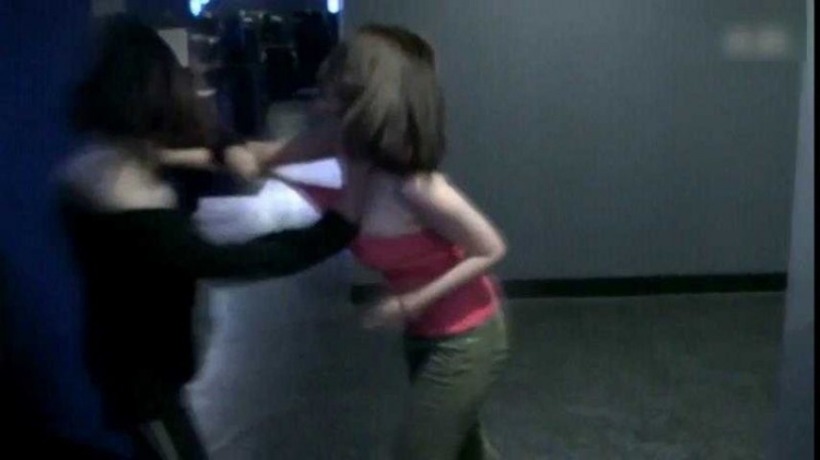 Two Female Gamers Brawl in Internet Cafe Caught on Camera 6 The fight continues despite torn clothing