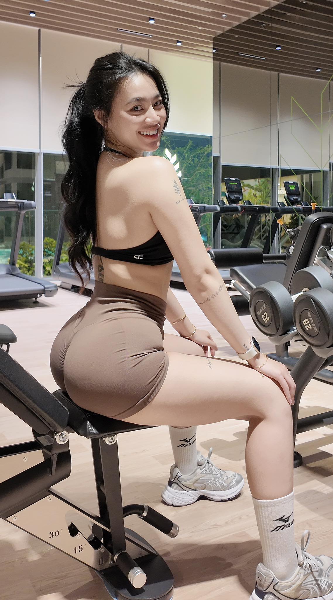 Trâm Anh Stuns with Confident Horseback Photos 6 Trâm Anh's confident pose in gym wear