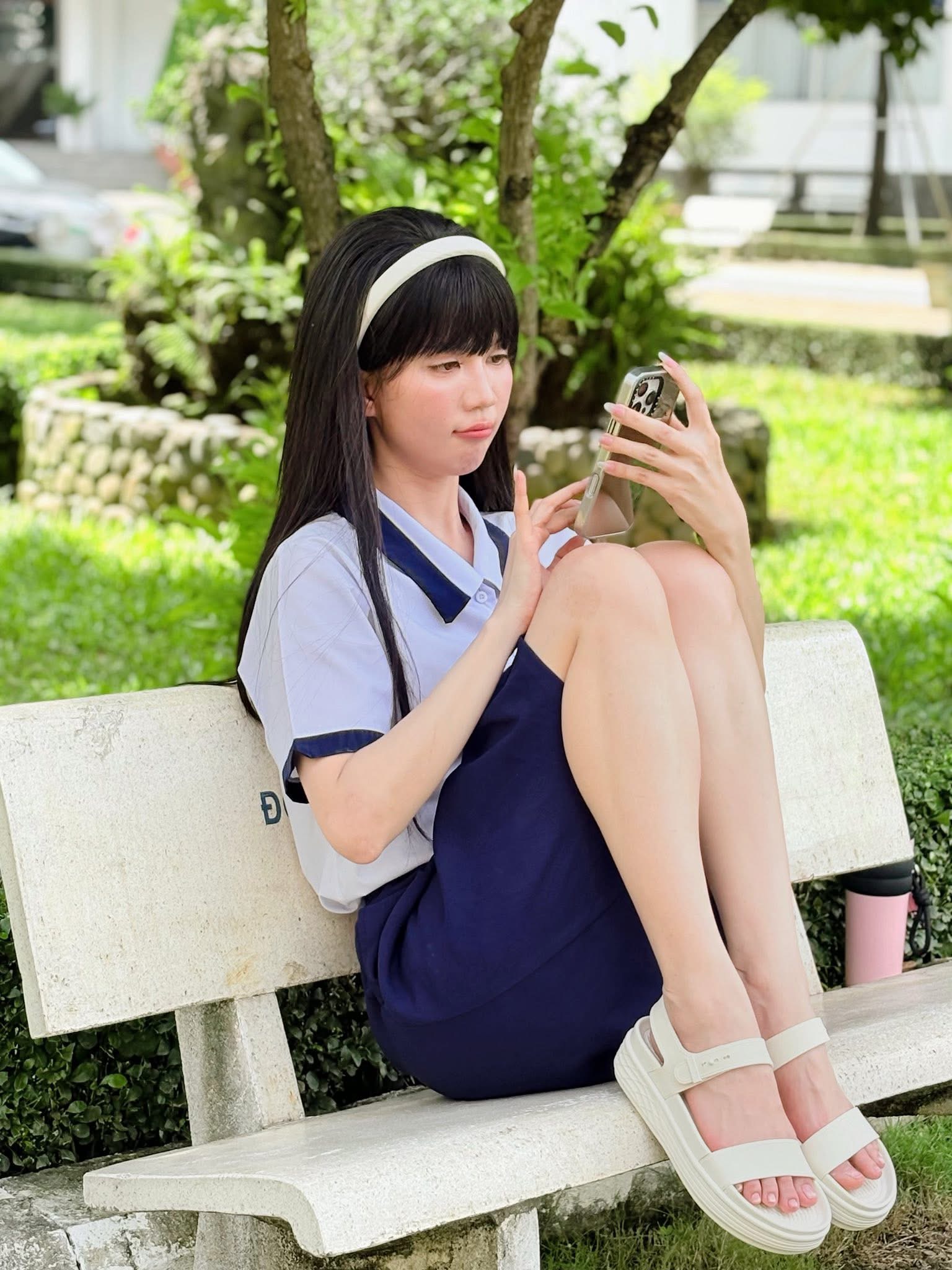 Ngọc Trinh Stuns Fans with Stunning High School Photo Shoot 2 Ngọc Trinh looking youthful in a school uniform.