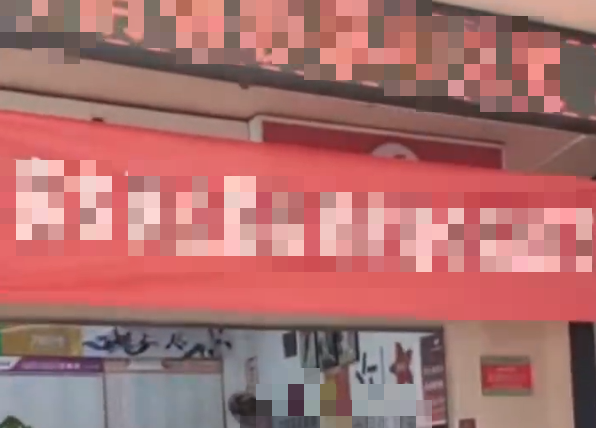 How a Rainy Day Lottery Ticket Made Her a Millionaire 2 Lottery shop with red banner congratulating lucky customer