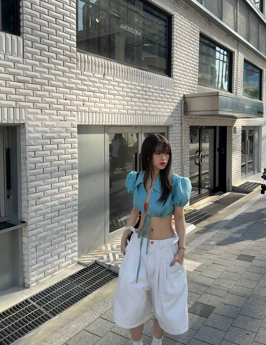 Linh Ka showing off her slim waist