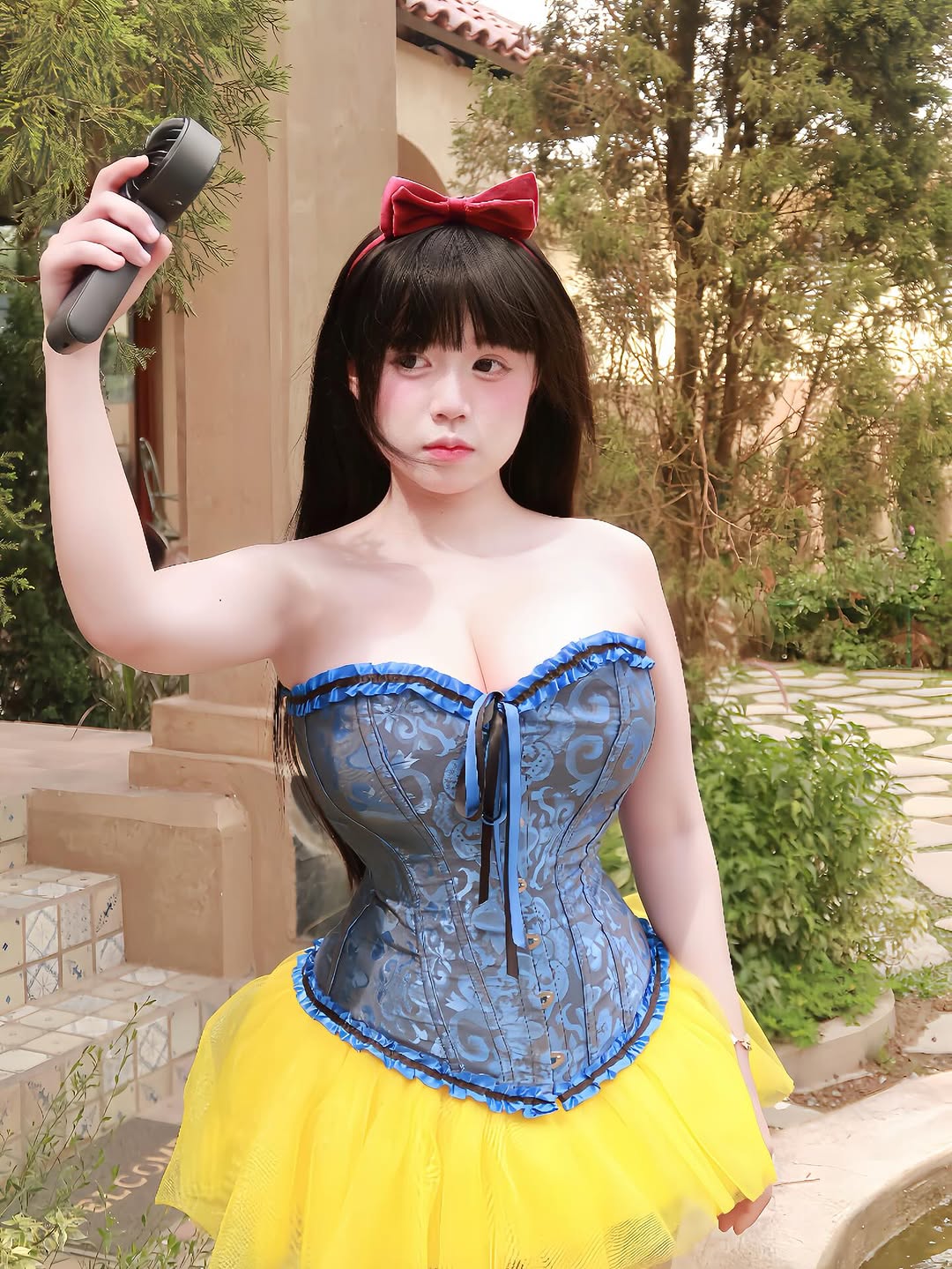Elegant Snow White cosplay pose