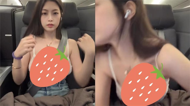 Yumi.k adjusting her pillow on plane