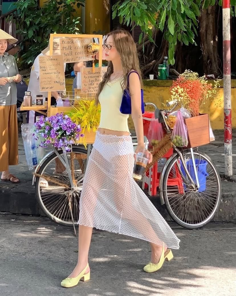 Controversial See-Through Outfit Sparks Debate in Hoi An 2 Close-up of sheer skirt outfit