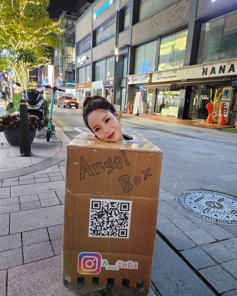 Korean Influencer Faces Jail for Public Breast Touch Challenge 2 She cut holes in the upper part of the box and asked men to touch her chest.