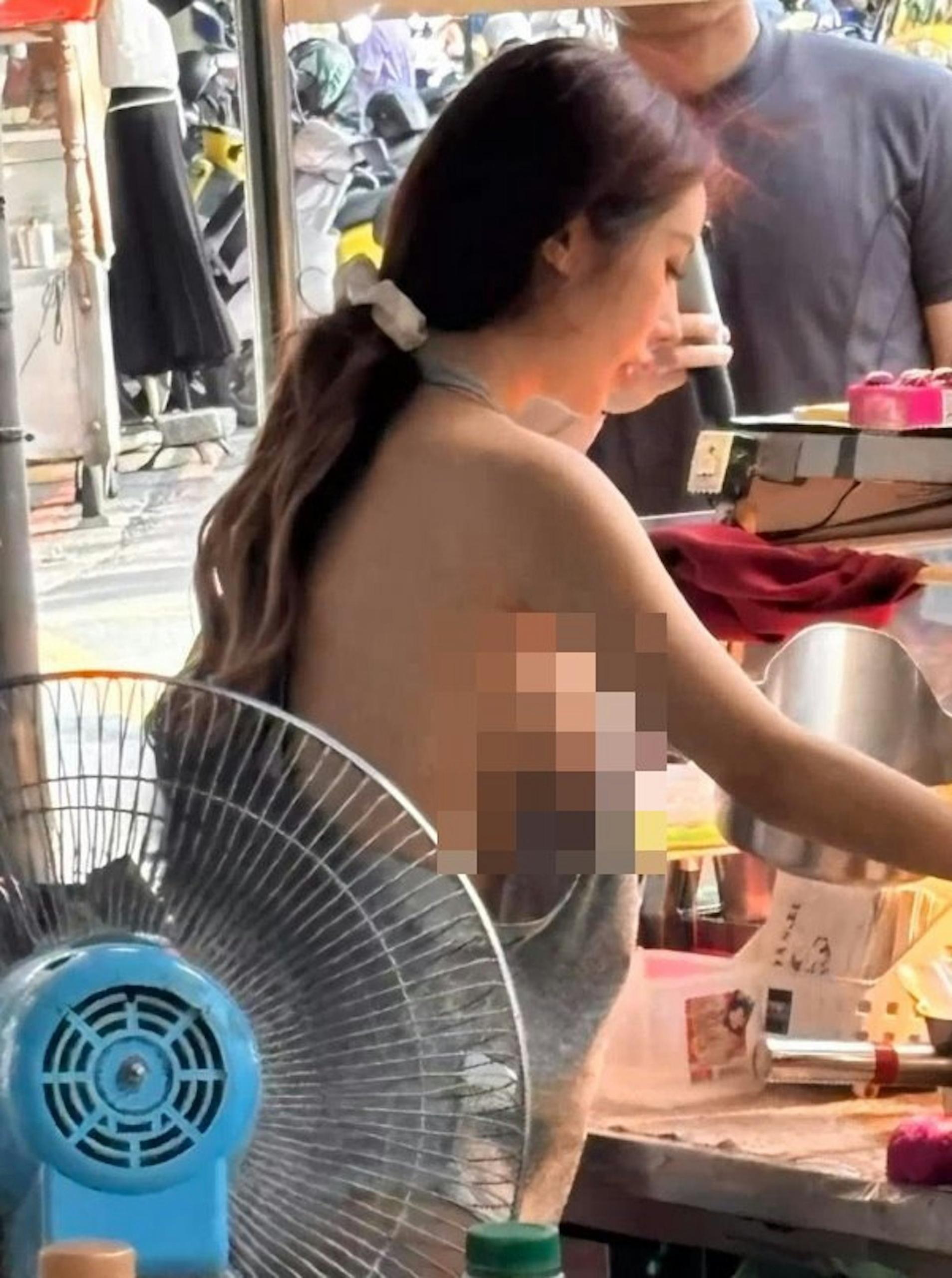 Hot girl selling fried ribs wearing a tiny apron