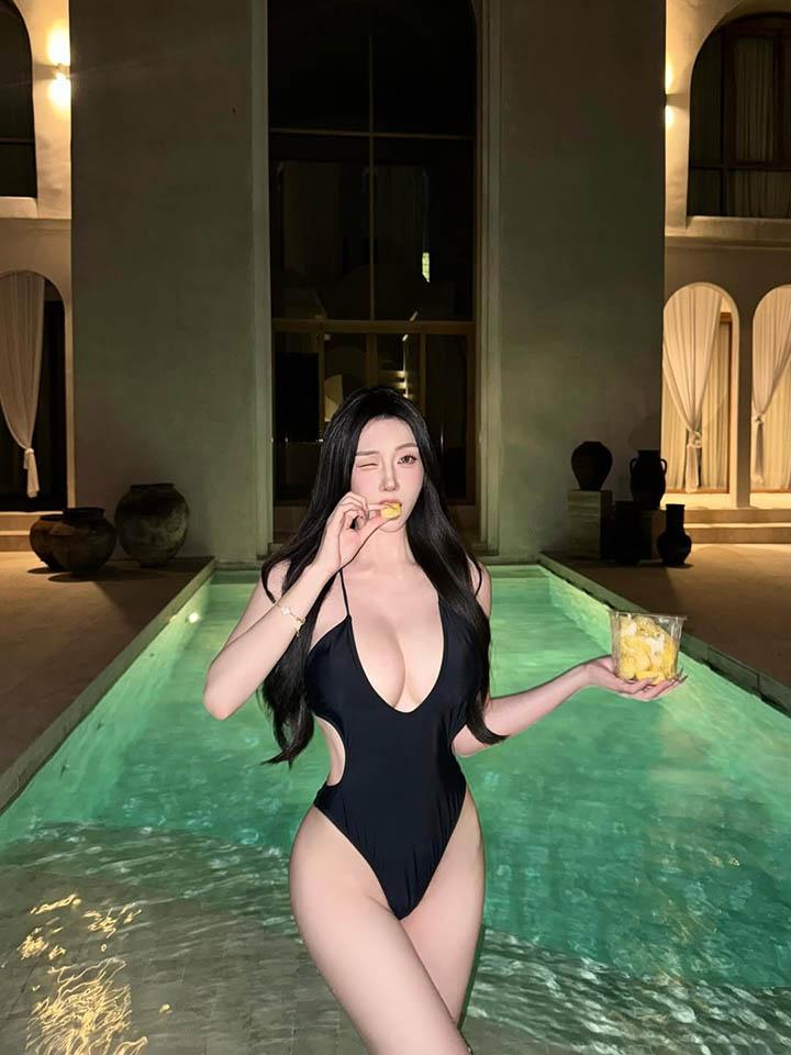 Gilgie in a sleek cocktail dress