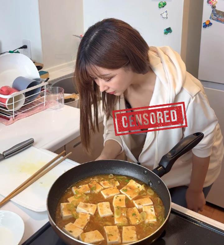 Saki cooking in kitchen