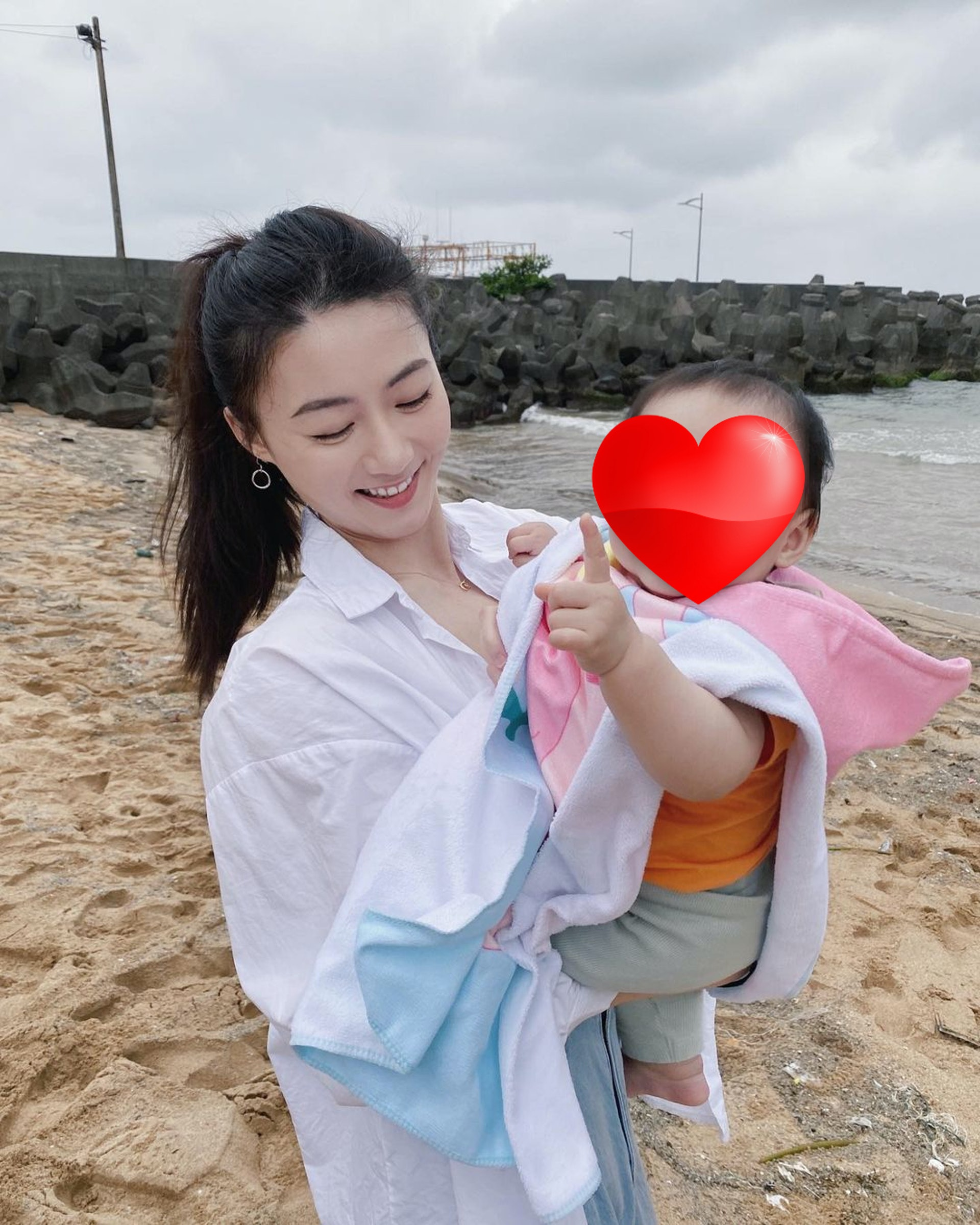 Ah Chu smiling with baby
