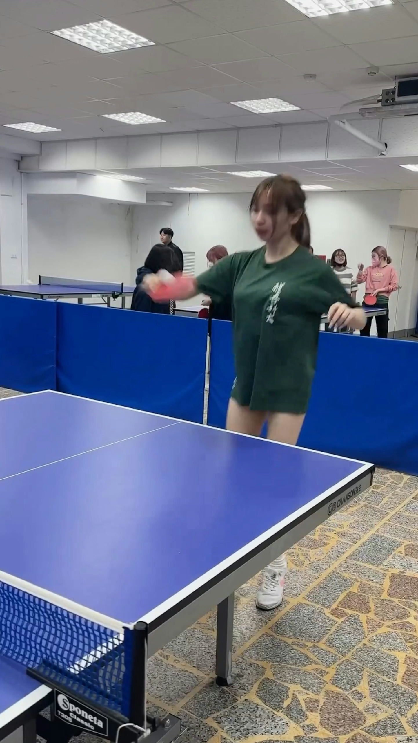 Shu Shu playing ping pong