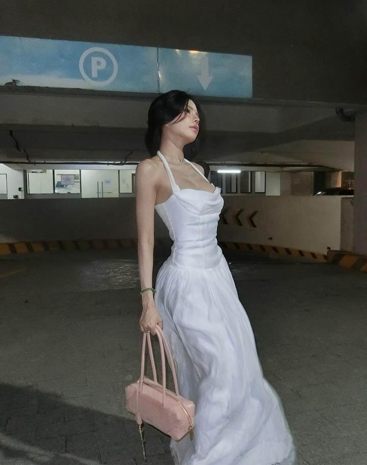 Mai Dora Shares Stunning Photos with a Fan-Favorite Name 4 Mai Dora's sculpted figure in a white dress