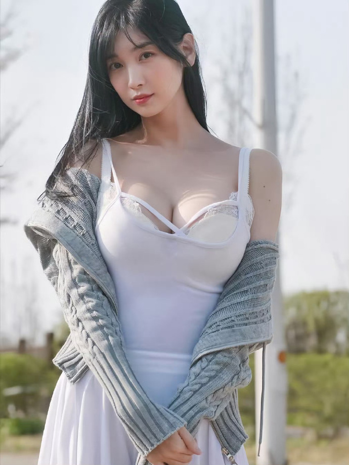 Leezy playing piano in a revealing outfit