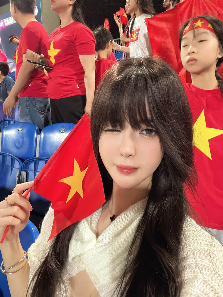 Phuong Khanh Ly smiling in stands