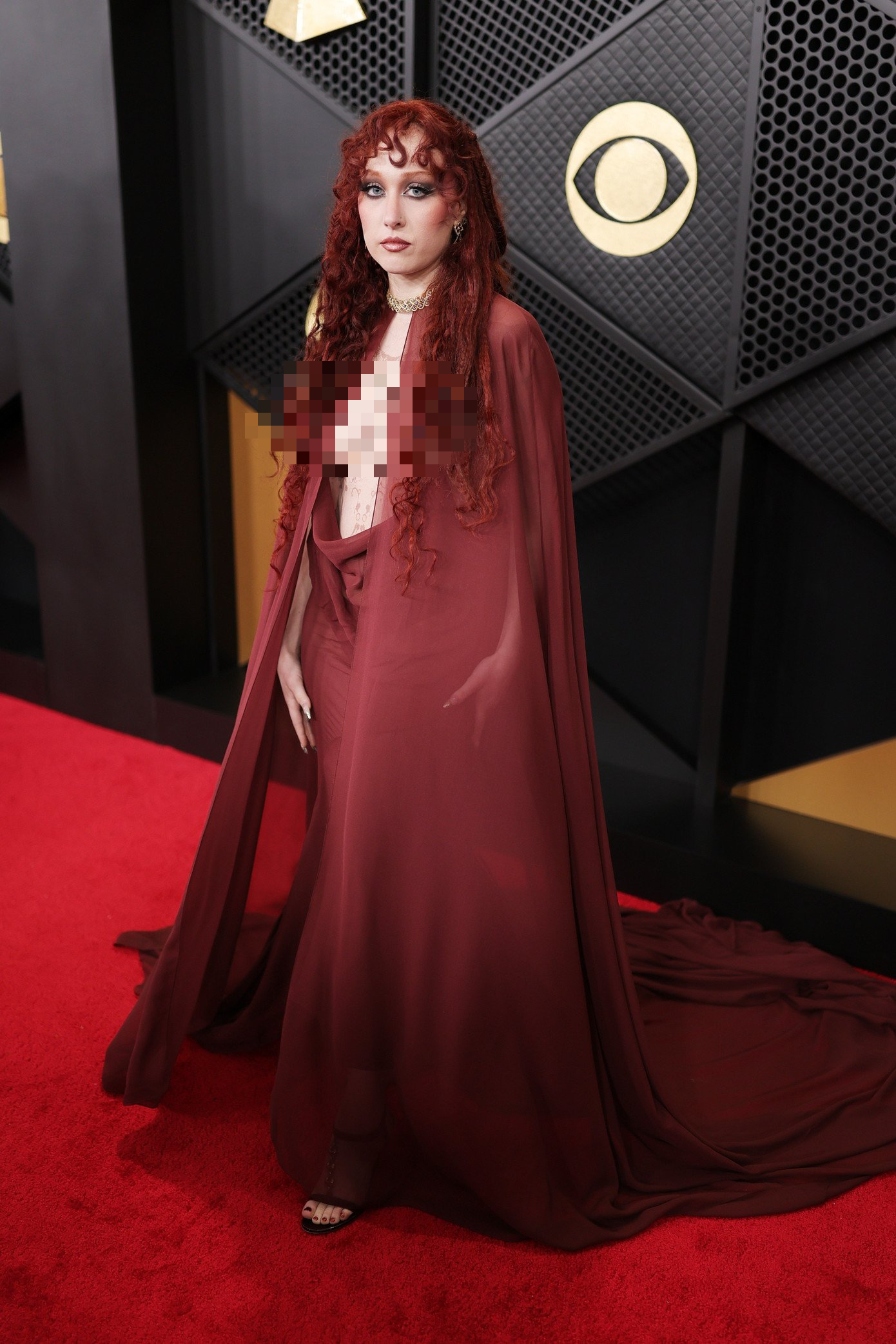 Grammy red carpet features a shockingly revealing dress, worst part is the over-the-top chest coverage - Image 1.