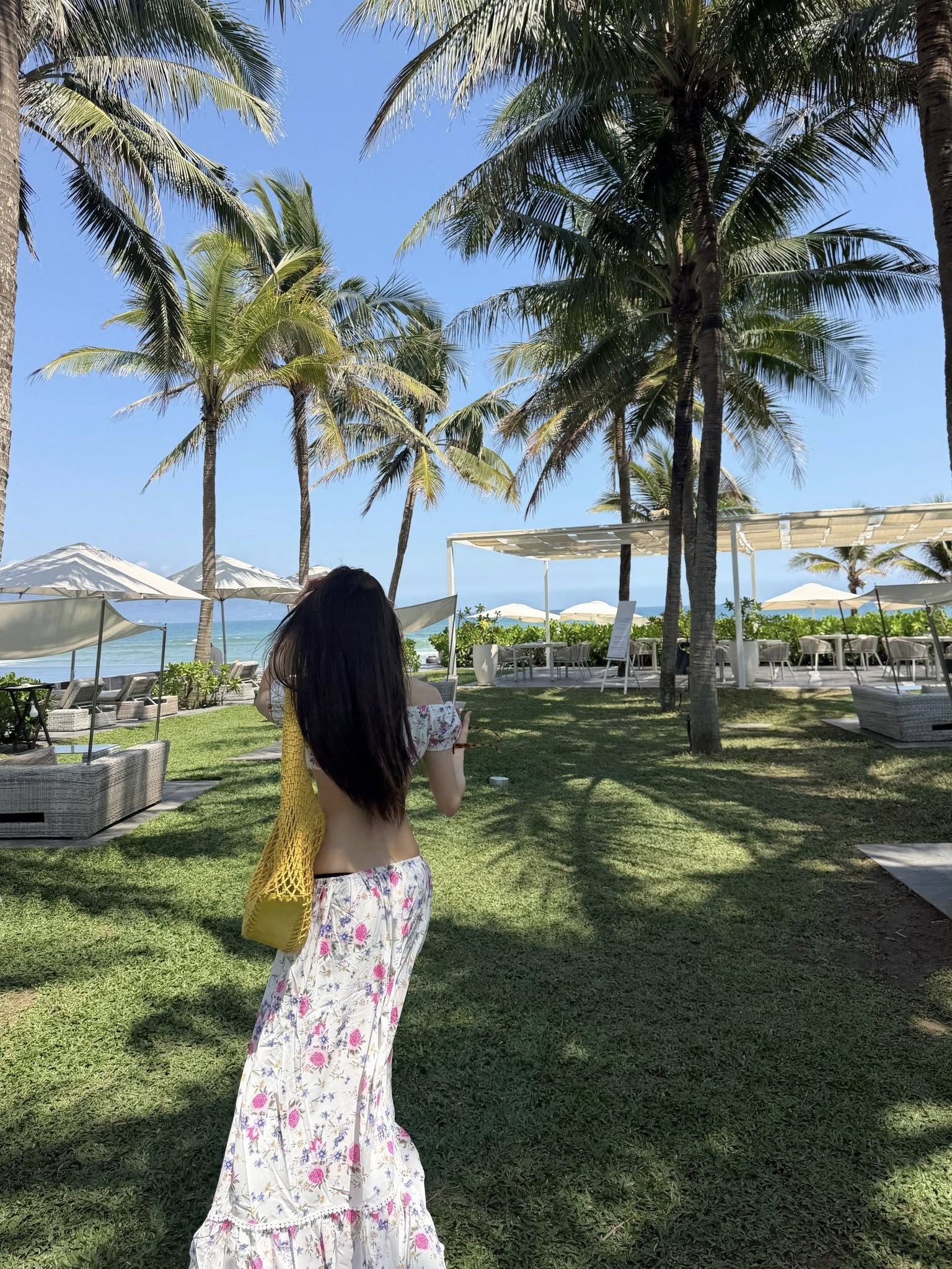 Thiều Bảo Trâm Kicks Off Bikini Season with Stunning Beach Looks 9 Thiều Bảo Trâm in floral dress