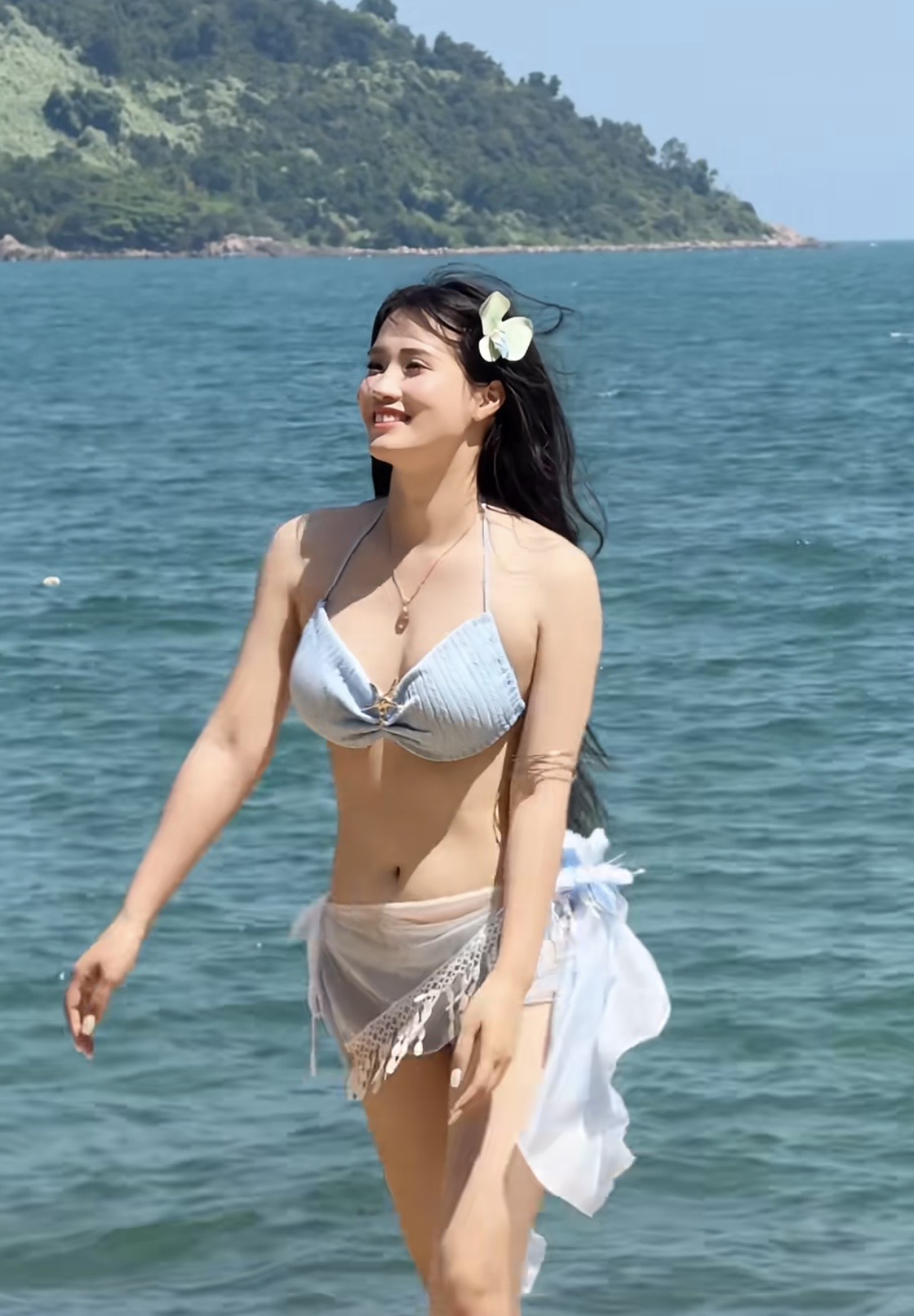 Kindergarten Teacher Stuns with Beach Glow and Perfect Figure 7 Teacher glowing with confidence on the beach