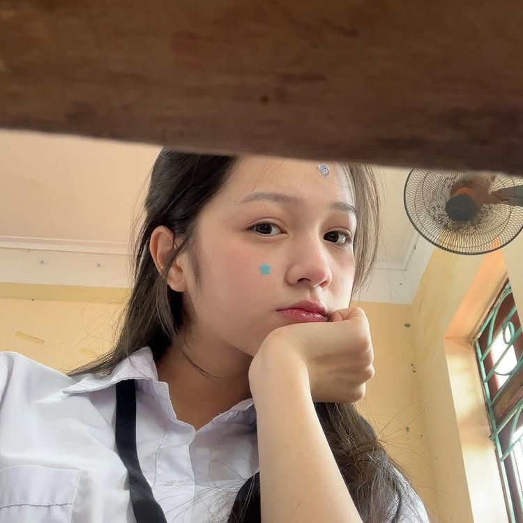 Schoolgirl's Fresh Photos Capture First Love Vibes 5 Schoolgirl looking thoughtfully