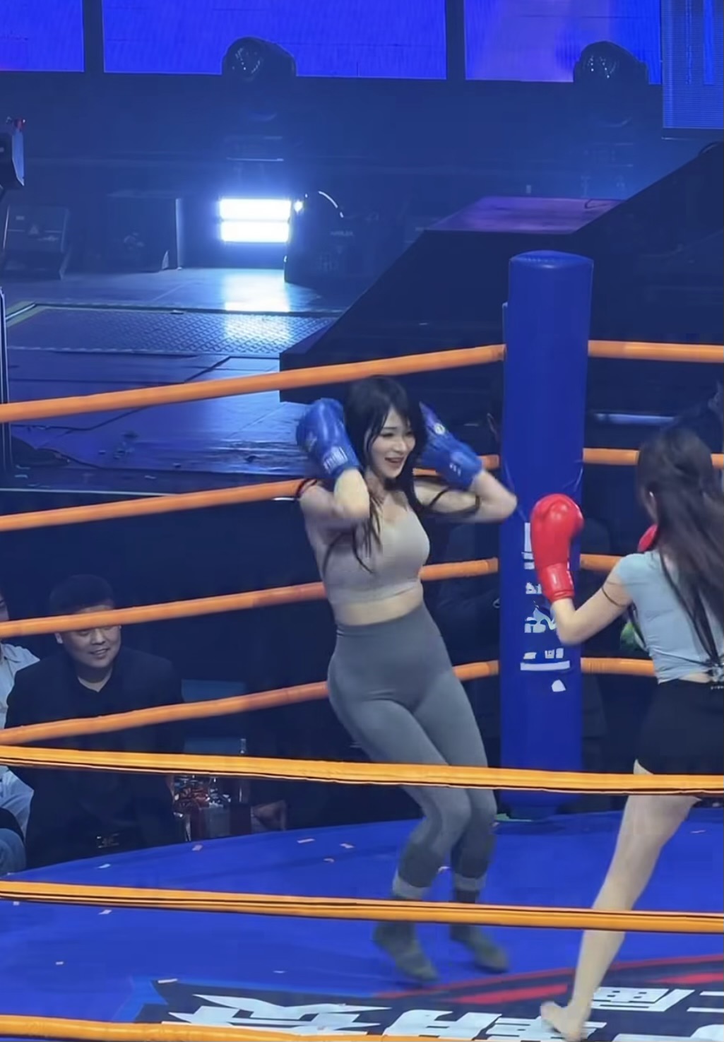 Female cosplayer in boxing ring