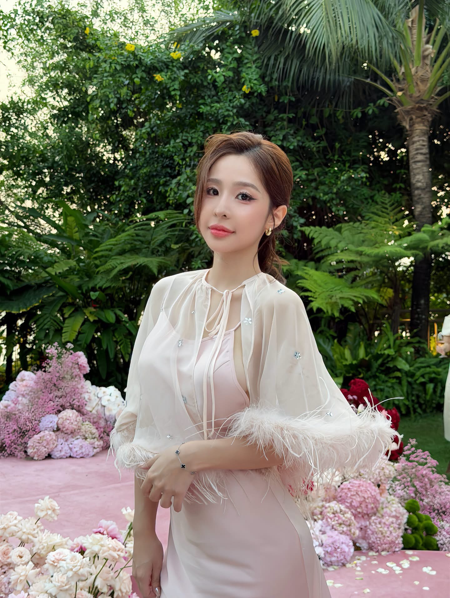 Tammy Phạm posing elegantly with bare back
