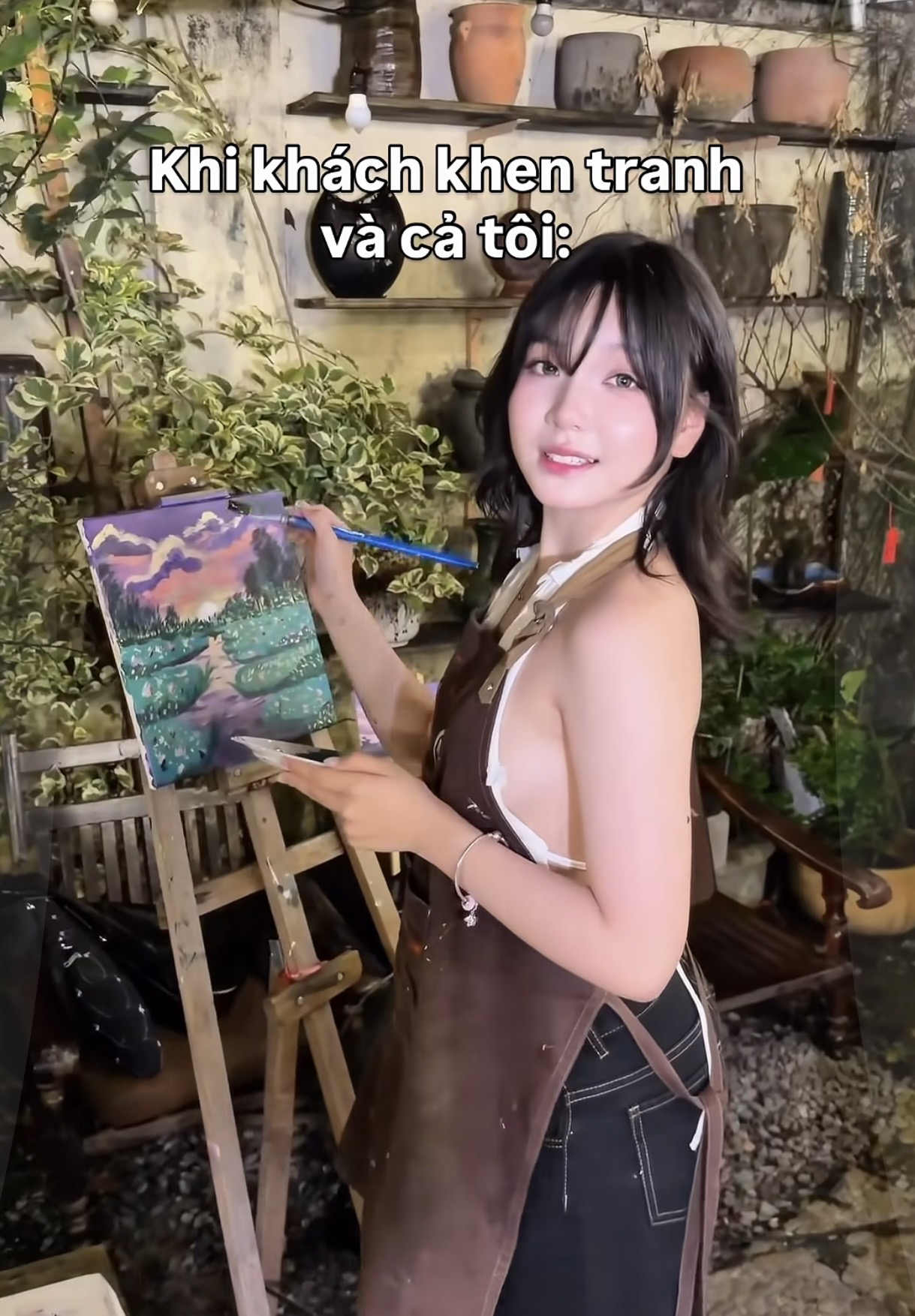 Painter smiling happily while working
