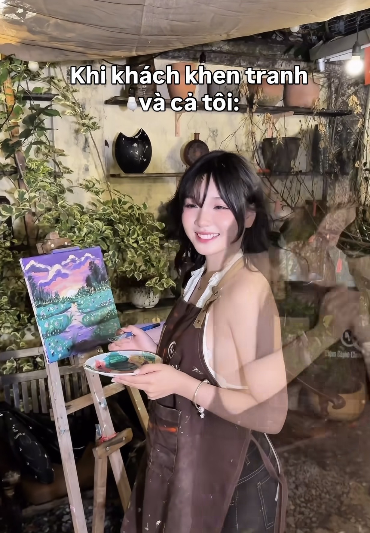 Painter surrounded by colorful art supplies